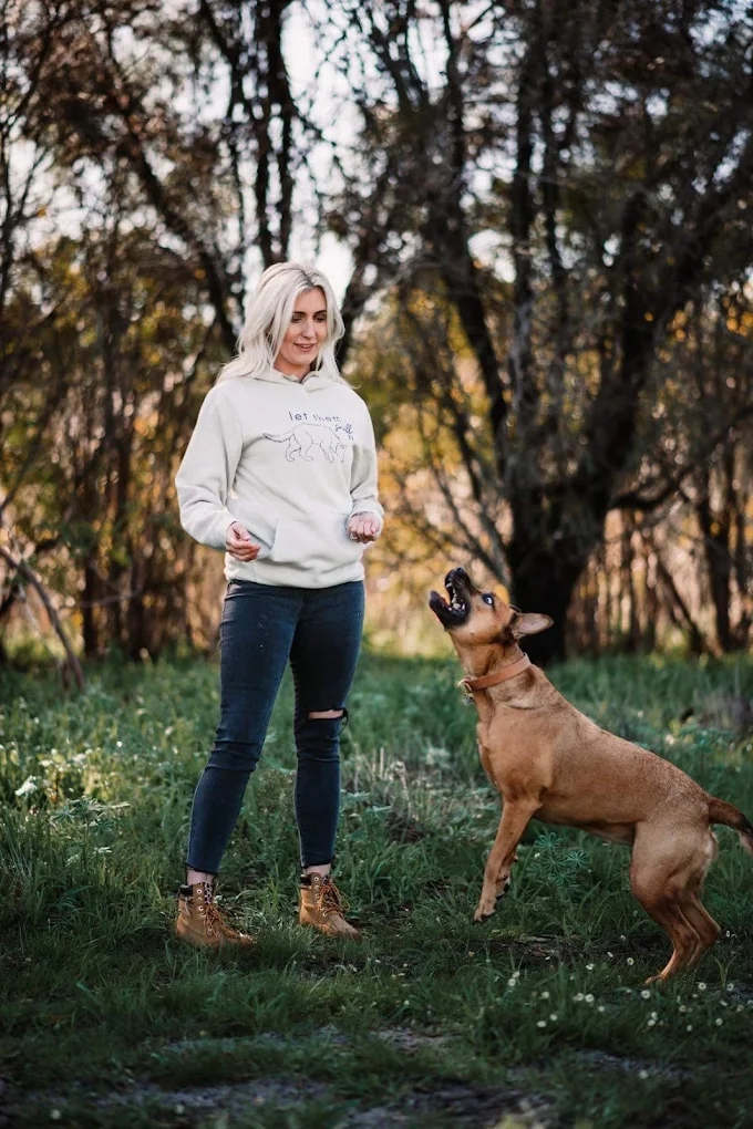 Lauren working with a happy dog outdoors